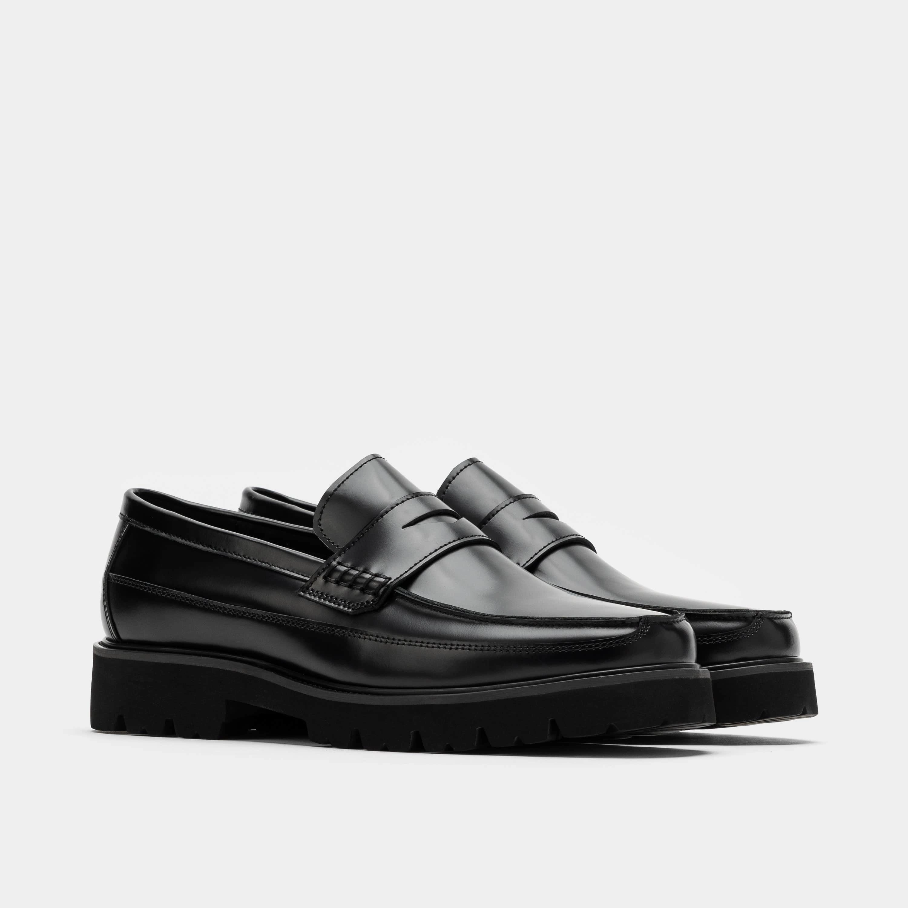 Contemporary Appeal Adler Black Leather Lug Penny Loafers