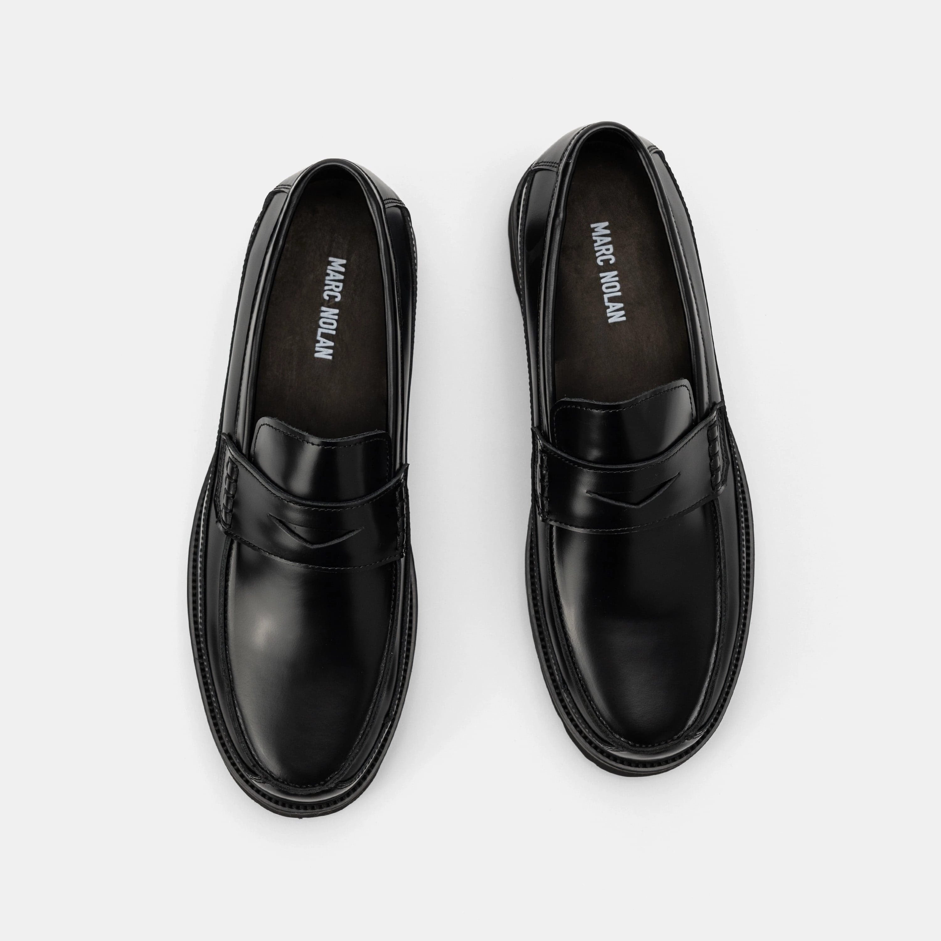 Contemporary Appeal Adler Black Leather Lug Penny Loafers