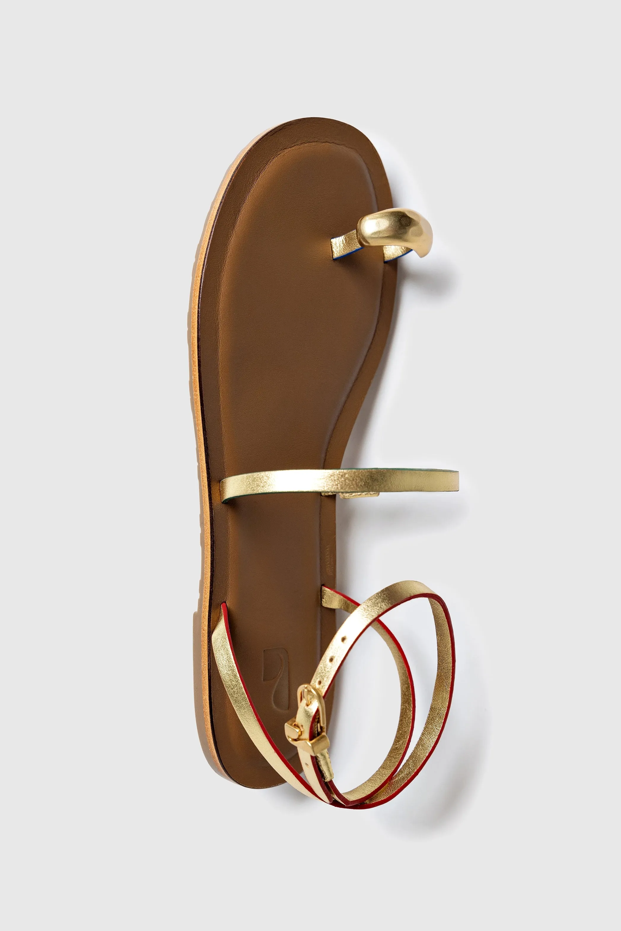 Flexible Fit Biarritz Flat Sandal In Gold Metallic Leather