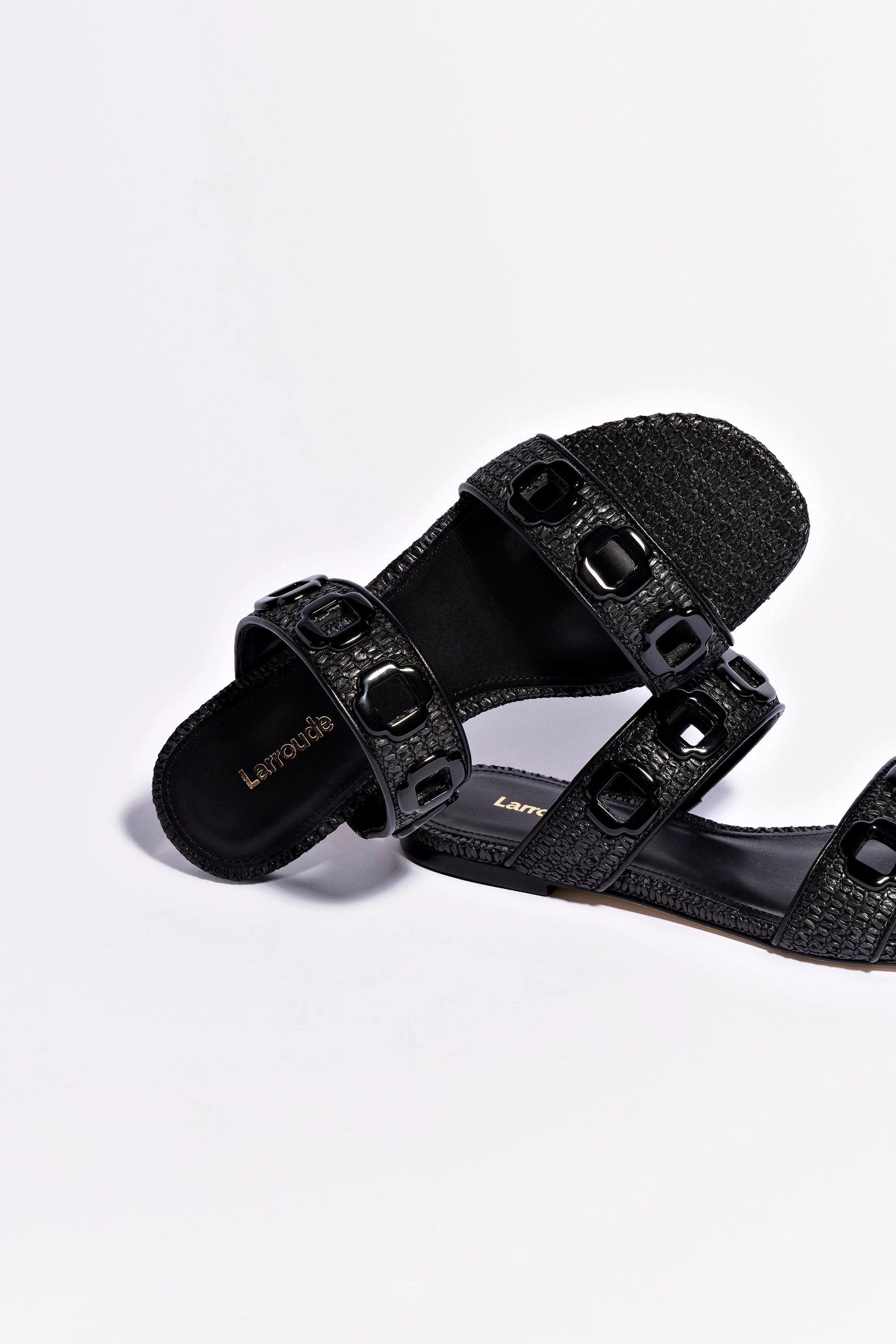 Milan Flat Mule In Black Wave Raffia Step Lightly